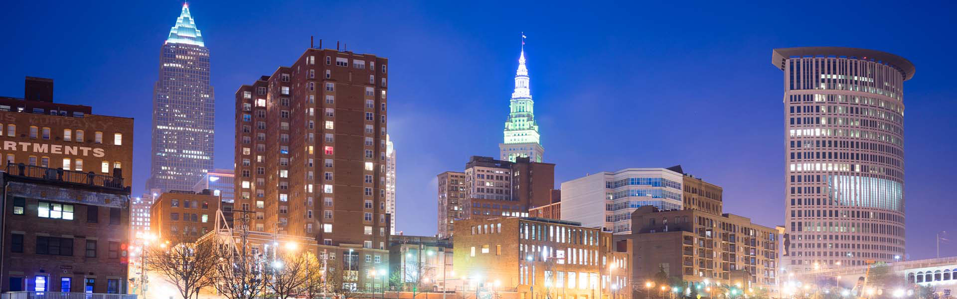 Neon color image of a band playing and people singing along