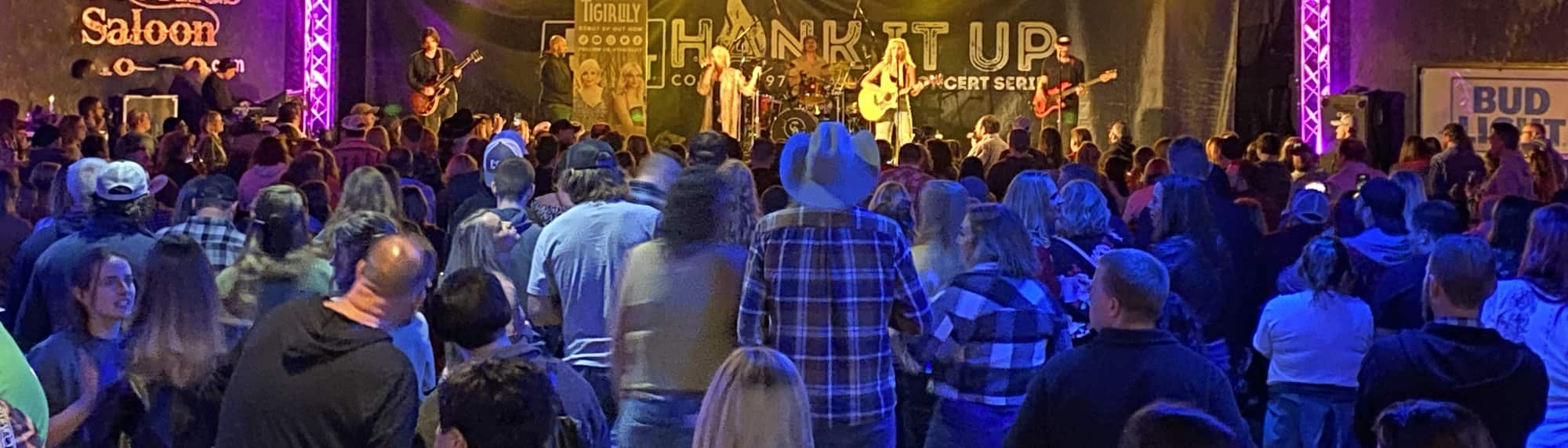 country concert with fans wearing cowboy hats Cleveland
